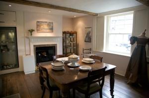 The dining room/front room, which has the china set used by the Austen family. Jane's writing desk is tiny and tucked over in the corner next to the window, where she could observe village life.