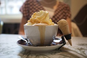 Mochacinno with whipped cream and toffee sauce with a miniature ice cream cone on the side. Decadence!