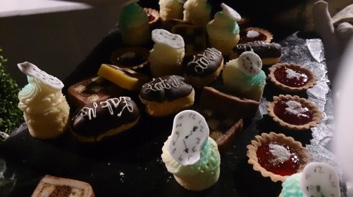 Very "Alice"-themed treats were carried round by the servers. Note the "Eat Me" theme and the clocks! (Cathy Hay)