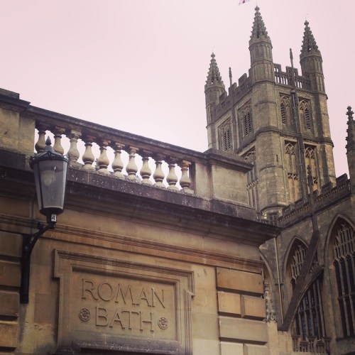 Bath Abbey, peeking over the roofline of the Roman Baths.
