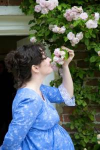 Stopping to smell the roses climbing next to the back door...
