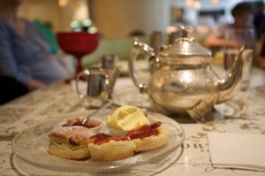 Two scones, clotted cream, strawberry preserves, and Darjeeling - yummy!