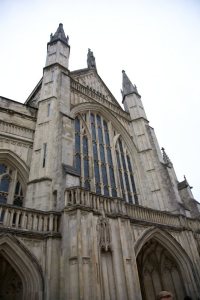 Winchester Cathedral towers above us.